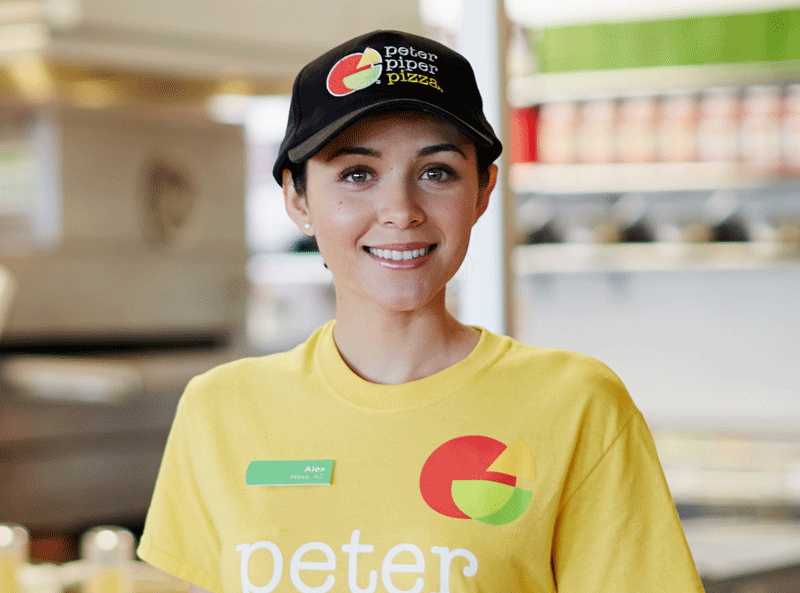 Peter Piper Pizza Female Team Member in Yellow shirt.